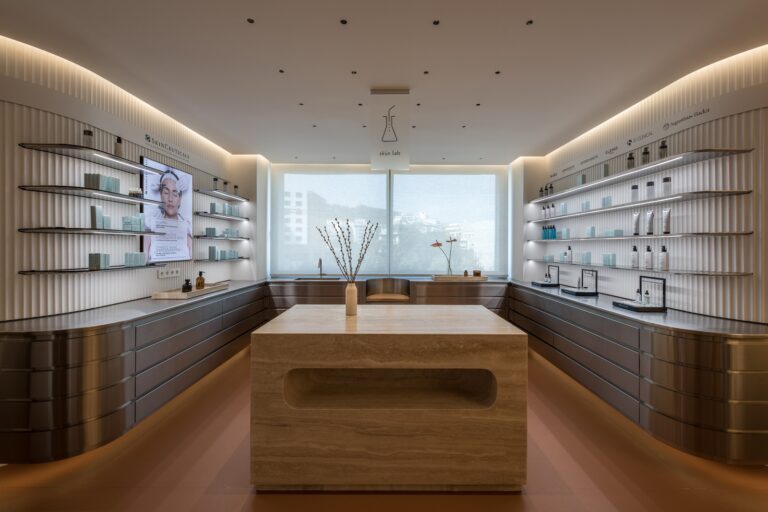 Soothing colors + curved volumes engulf Tzouma Dermatology Clinic’s interior spaces in Athens by ARID Architects